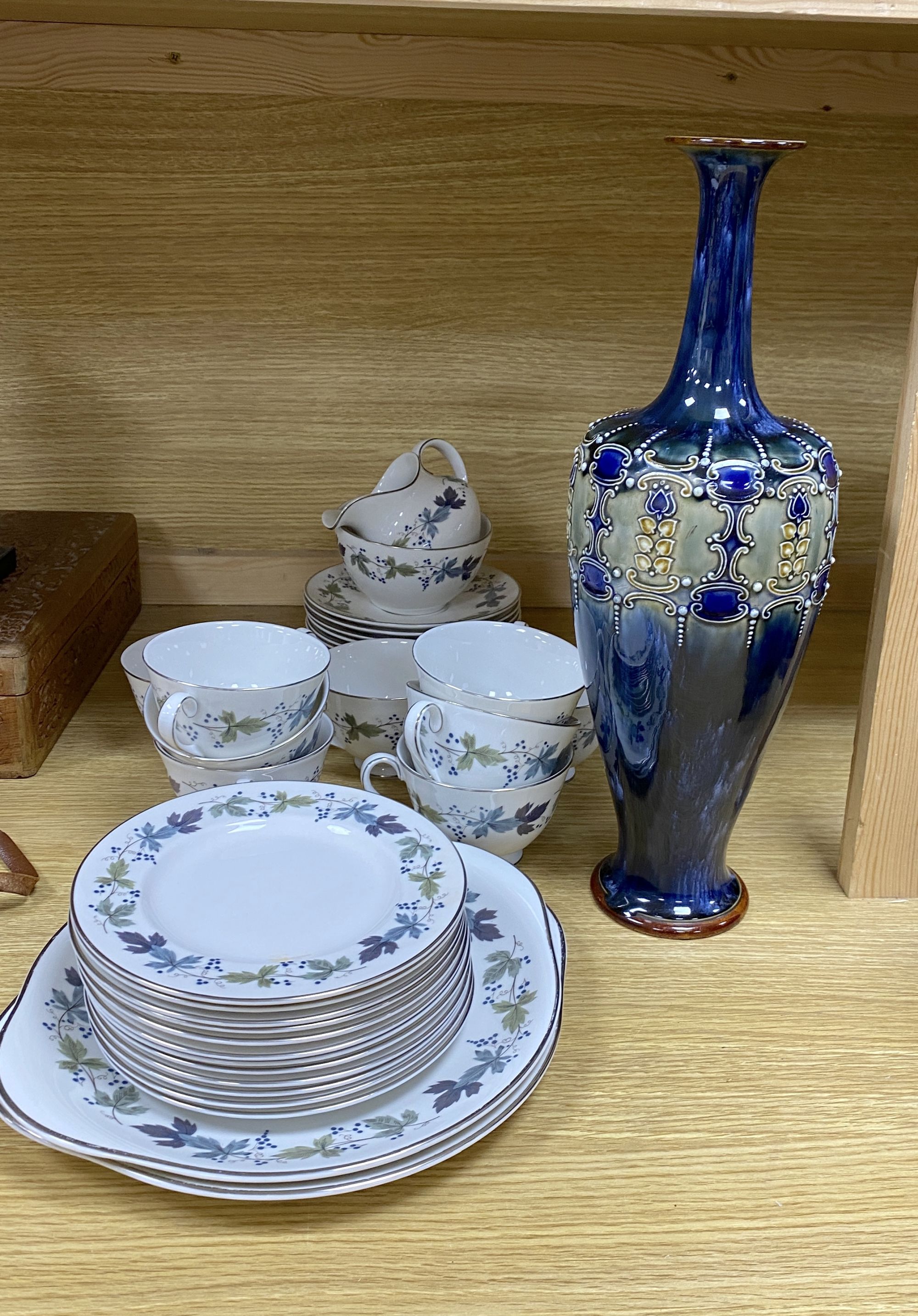 A Royal Doulton Burgundy pattern tea cups and saucers and a Doulton stoneware vase